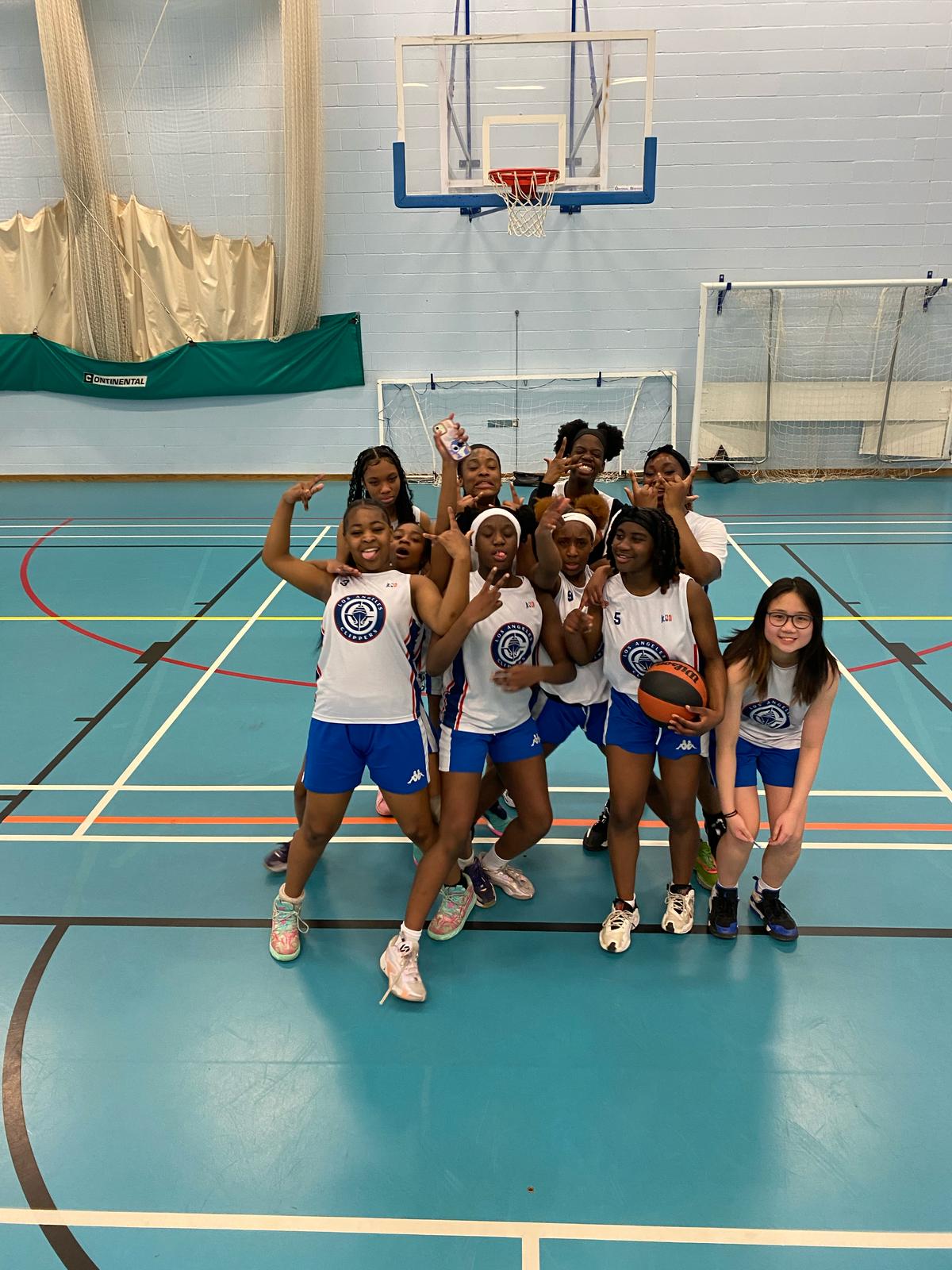 St Peter's Collegiate Academy's Girls' Basketball team celebrating after a victory