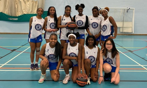 St Peter's Collegiate Academy's Girls' Basketball Team celebrating after a victory.